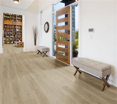 8mm NuCore Flaxen Blonde Rigid Core Luxury Vinyl Plank - Cork Back looks and feels like wood and tile, but can be installed where real wood cannot. . Gray blonde rigid core luxury vinyl plank  cork back